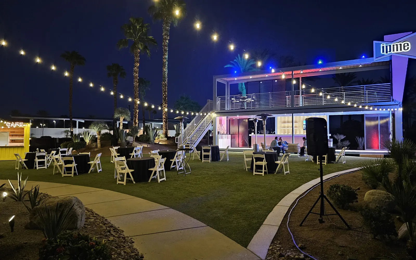 IPME container activation at night under string lights, EDPA Access 2024